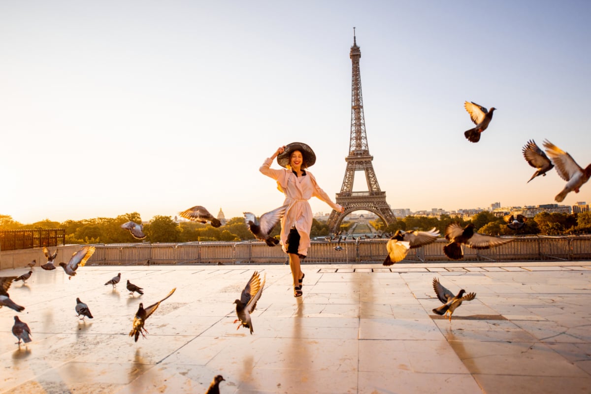 woman dancing in front of the Eiffel Tower, Paris